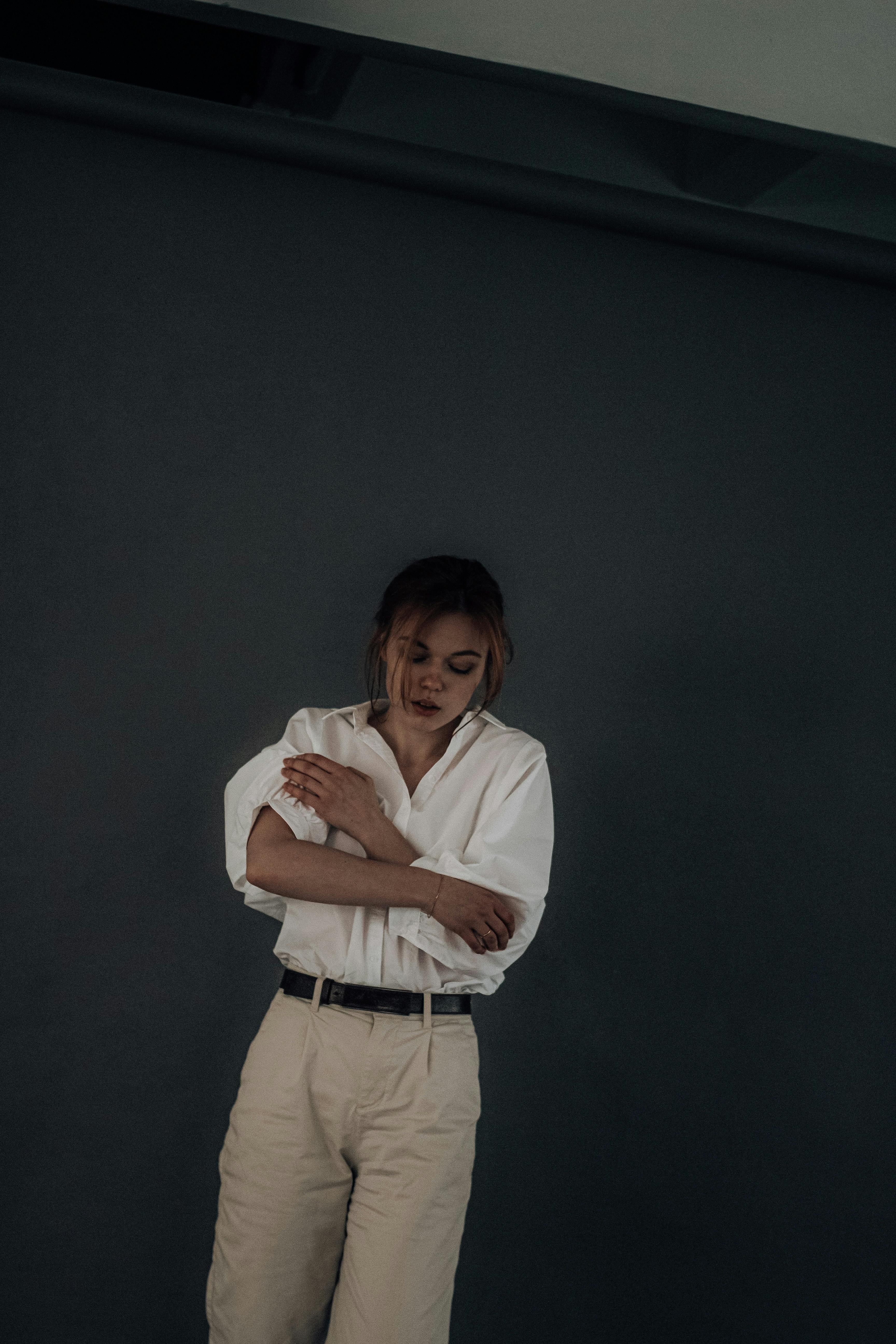 White shirt and sand linen trousers on model in resort setting